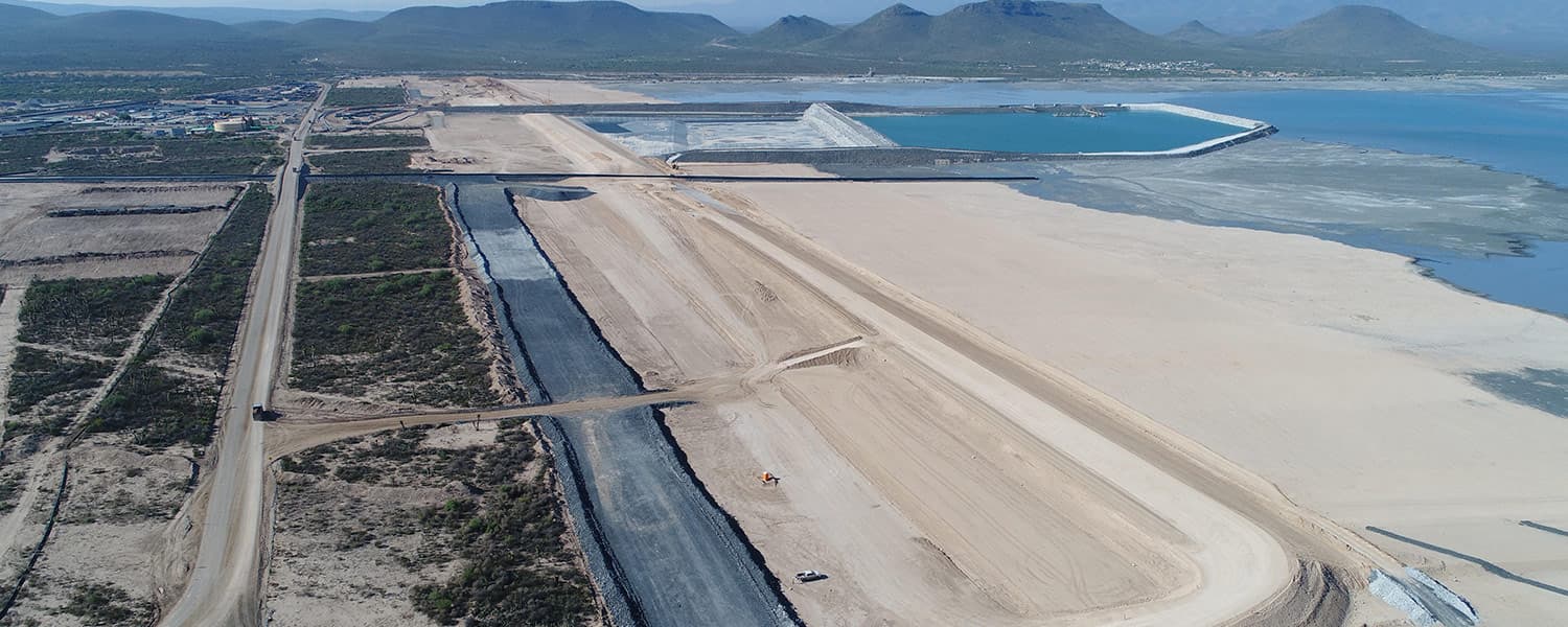 Aerial view of the Peñasquito tailings storage facility in Zacatecas, Mexico, with a lined tailings dam raise under construction and the tailings pond beyond