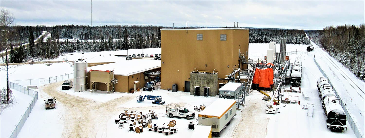 The SO2Clean liquid sulphur dioxide production facility in Northern Ontario in winter, with the plant building, storage tanks and rail tank cars